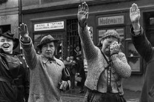 People of Eger, in the Sudetenland (now Cheb, Czech Republic), greet German soldiers with the Hitler salute in October 1938