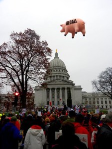 November 19, 2011, Madison Wisconsin, Capitol. Protesters create a "flying pig" to celebrate the official opening day of the Scott Walker Recall.