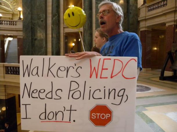 "Walker's WEDC needs Policing, I don't" from Solidarity Sing Along 9/27/2012 at WI State Capitol. Photo: Lisa Wells