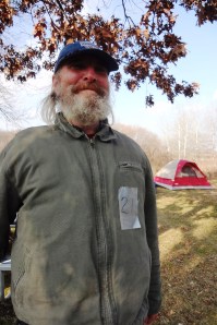 Oscar P. was given the number 21 on a piece of duct tape to wear so that he could be reunited with his belongings after they were confiscated and "inventoried." Photo by Rebecca Kemble