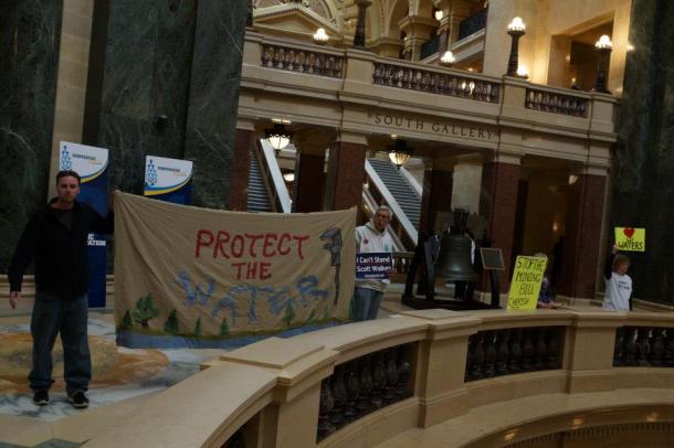 Protesters in the rotunda outside the public hearing on AB1/SB1 on 1/23/13.