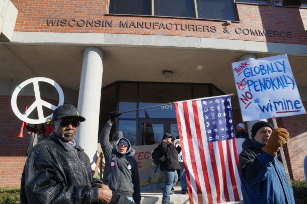 The Protect Wisconsin's Waters rally marched down to Wisconsin Manufacturers and Commerce who hacve lobbied heavily in favor of the legislation that would make mining a reality in Wisconsin.