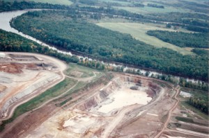 The Flambeau Mine (a Kennecott/Rio Tinto project) operated on the banks of the Flambeau River near Ladysmith, Wisconsin in the mid-1990s. This photo was taken in 1994 when the river flooded during heavy rains and came within 20 horizontal feet and 4 vertical feet of spilling into the mine pit.(Photo by Bob Olsgard of Sarona, WI, September 17, 1994)