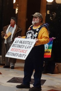 Singers sharing their messages in song, sign and banner on February 13, 2013.