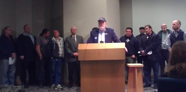 L to R: Washburn Mayor Scott Griffith, Carl Dorsch (Ashland), Rusty Barber (Lac Courte Oreilles), Ashland City Council Richard Ketring, Bad River Tribal Chair Mike Wiggins Jr, Bayfield Mayor Larry McDonald, (hidden) Rose Soulier (Red Cliff), Ashland Mayor Bill Whalen, Red Cliff Councilman Marvin Defoe, Brian Bainbridge (Red Cliff), Ashland County Board Member Charles Ortman,