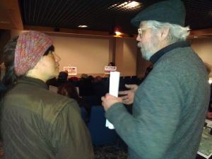 Local resident Sarah Martinez talks with Ashland City Council member Richard Ketring at the Bad River news conference.