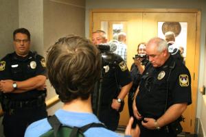 Police guarding the doors of the press conference where Walker was planning to unveil a new ad campaign for the Wisconsin Economic Development Corporation and credentialed journalists were denied access.  September 27, 2012. Photo: Jenna Pope