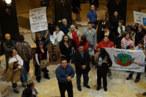 Bad River Tribal Chair Mike Wiggins Jr. addresses the crowd in the rotunda on February 27. His message was, "There will be no mine."