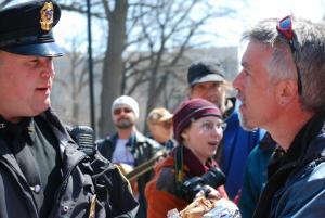 Detective Henry listens to a reciting of Article 1 Section 4 of the Wisconsin State Constitution. Photo by Dawn Henke.