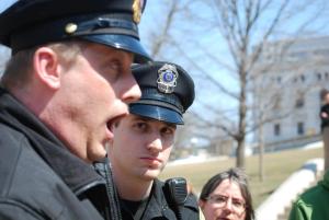 Capitol Police Lieutenant David Davis reacts to the recitation. Photo by Lisa Wells.