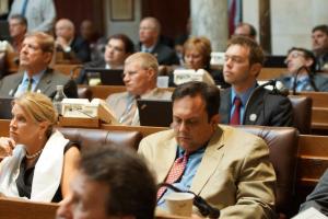 While some GOP legislators paid attention to the Dalai Lama, Rep Kleefisch played with his phone and Rep Tranel slept. Photo by Leslie Amsterdam