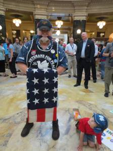 Lars Prip, A USMC Vietnam Veteran with his young frind Aidan in the rotunda of WI Capitol.