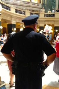 Officer Mitch Steingraber patrols the Solidarity Sing Along on July 16, 2013.