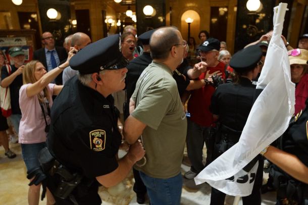 Vet arrested, VFP flag confiscated.