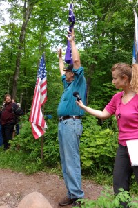 Paul DeMain speaks at the flag installation ceremony at the LCO Harvest and Education Camp, July 30, 2013. Photo by Rebecca Kemble