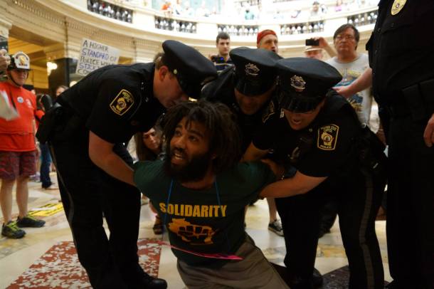 August 26, 2013 CJ Terrell is subdued using pain compliance techniques. He was arrested for singing at the WI Capitol without a permit.