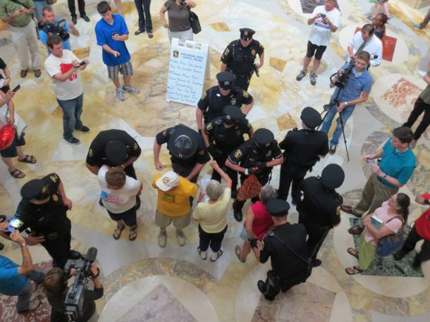 July 24, 2013 Capitol Crackdown arrests for singing begin over the noon hour with many singers refusing to stop singing.