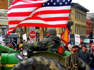 Wisconsin farmers drive their tractors to the Capitol to protest Walker's budget, March 2011. Photo: Michael Matheson