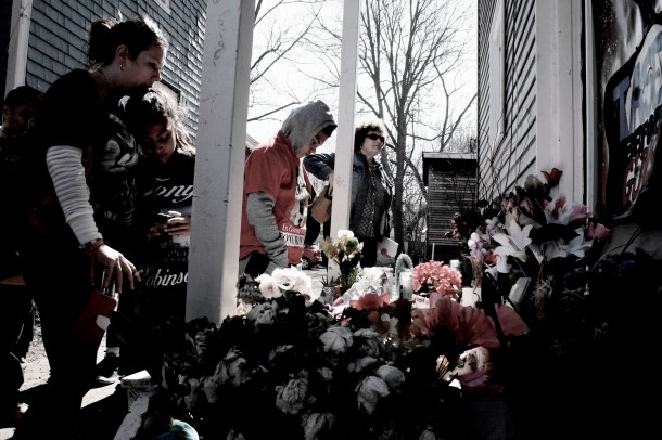 Tony Robinson's mother, Andrea Irwin and his sister at the porch where he was killed.