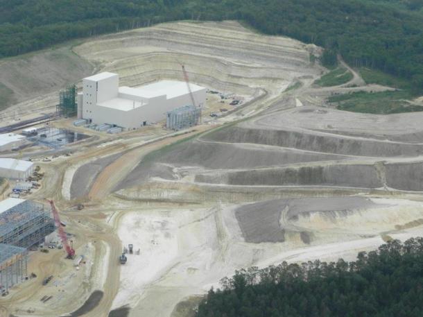 Mine in Unimen-Tunnel City. Vehicles next to building are semis, showing how big the building is. Photo: Save the Hills Alliance