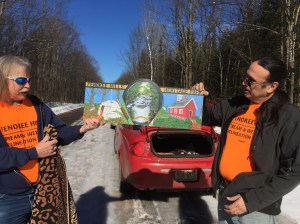 Wildlife biologist Gerggory Jennings shows off a new sign he created for the Penokee Hills Heritage Park Facebook Page, with Paul DeMain.